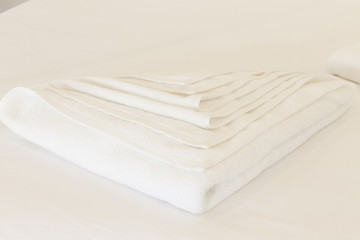Clean white towel on white background