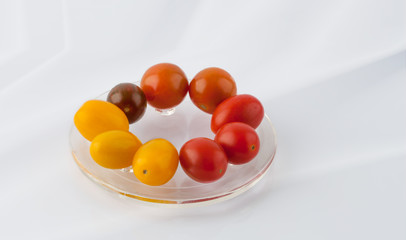 Group of colorful cherry tomatoes on a plate
