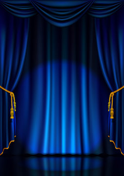 Theater stage with blue curtain and spotlight. 