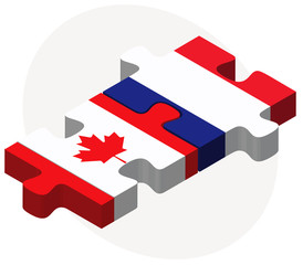 Canada and France Flags in puzzle