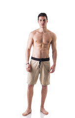 Fototapeta premium Full figure shot of handsome shirtless young man