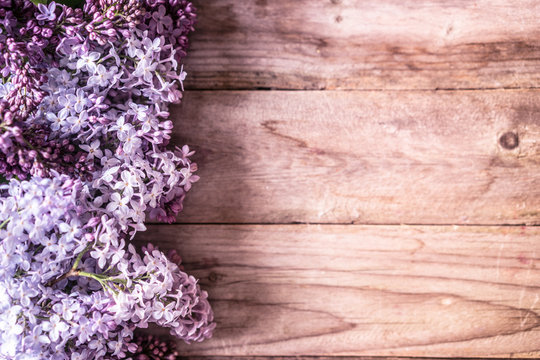 Lilacs on wooden backgorund