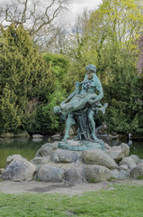 Fototapeta na wymiar A bronze statue of a fisherman holding a mermaid