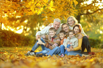 Fototapeta premium Family relaxing in autumn park