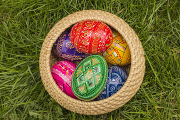 Easter Eggs in Wicker Basket in grass