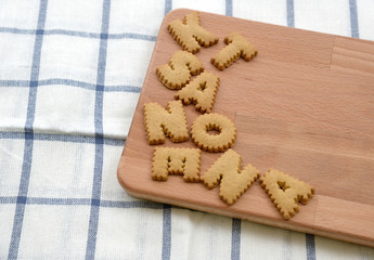 Biscuits ABC on wooden plate