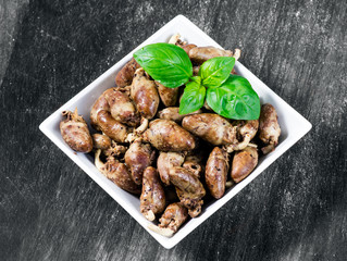 Fresh cooked chicken hearts seasoned with pepper and salt ready