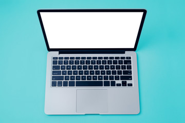 Fototapeta na wymiar Laptop with white blank screen over blue background