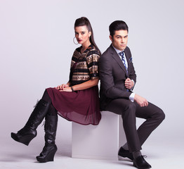 Young fashion couple sitting