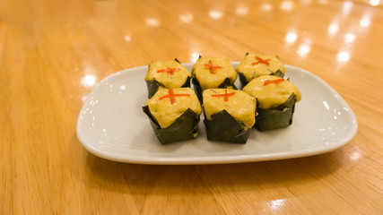 Curried fish wrapped in banana leaves and streamed