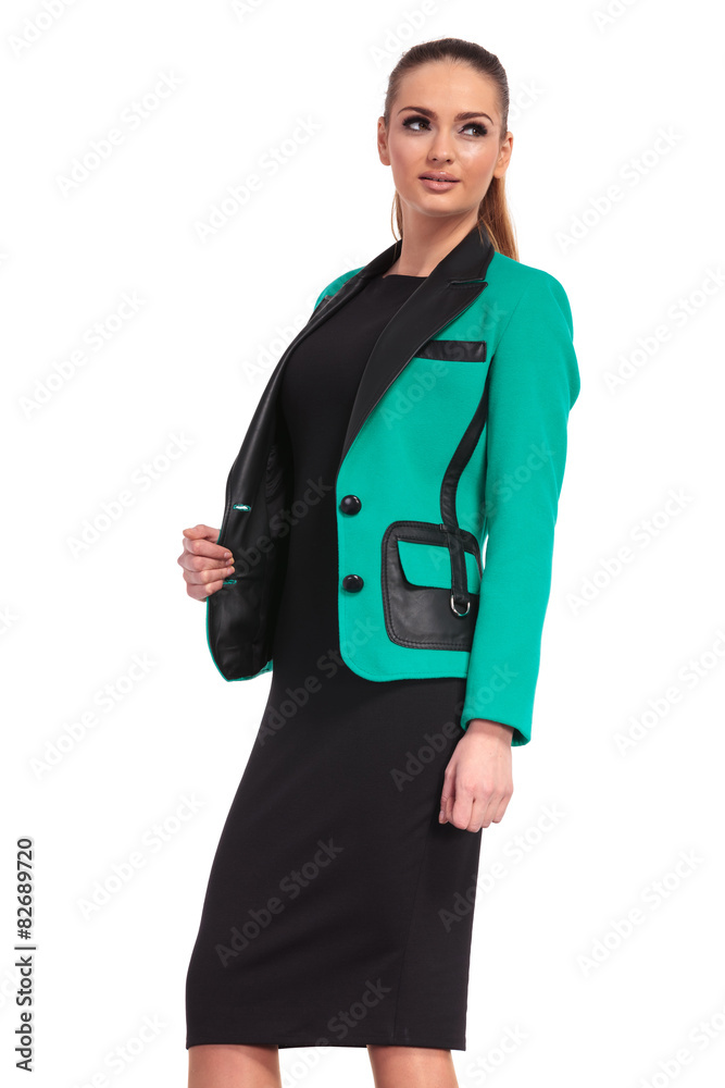 Wall mural elegant business woman pulling her jacket