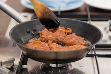 Frying Onion Bhajis in a Frying Pan