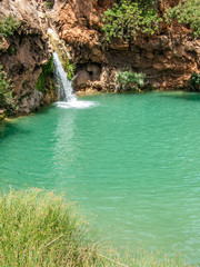 Fototapeta na wymiar Small waterfall in Pego do Inferno