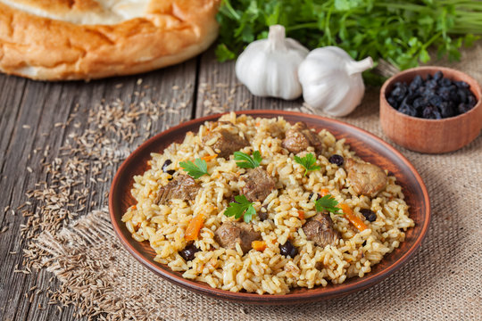 Arabic traditional rustic rice food pilaf cooked with fried meat