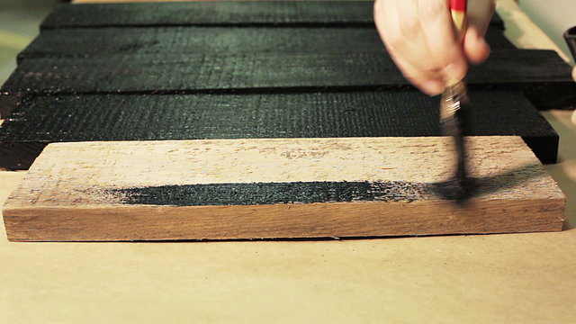 Process of Painting the Wooden Boards with the Brush 2