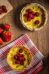 Lemon tart with rosemary and berries