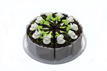 chocolate pie with green and white cream, on a plastic tray