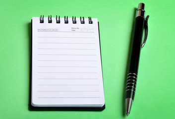 Empty notebook and pen