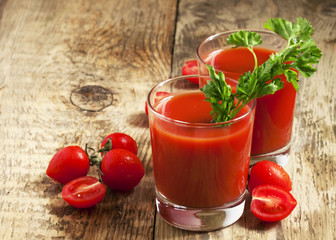 Fresh tomato juice with herbs and tomatoes, selective focus
