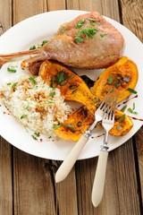 Roasted turkey leg with butternut squash, pumpkin seeds and rice