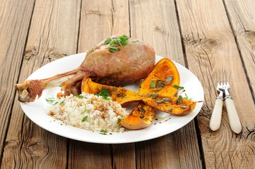 Roasted turkey leg with butternut squash, pumpkin seeds and rice