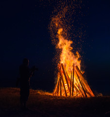 Big bonfire against dark night sky