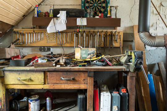 Messy table of tools in a workshop
