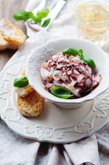 Octopus carpaccio in the table