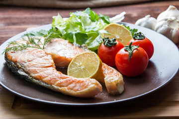 grilled salmon on the wooden table