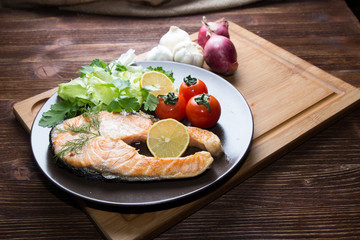 grilled salmon on the wooden table