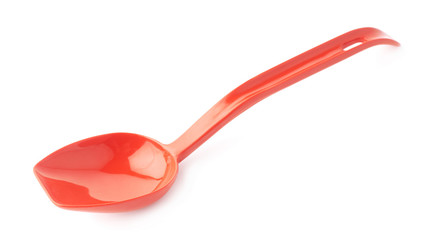 Red plastic kitchen scoop isolated