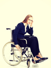 Obraz na płótnie Canvas Tired businesswoman on a wheelchair
