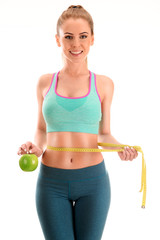 Young woman measuring herself. Weight loss