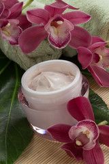 Obraz na płótnie Canvas Face Cream and Pink Orchid