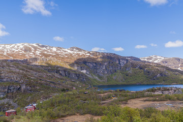Fototapeta na wymiar Small village in the mountains of the fjord, Norway