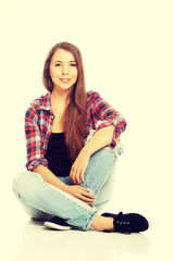 Fototapeta premium Woman sitting cross-legged