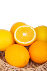 fresh orange fruits in basket on wood