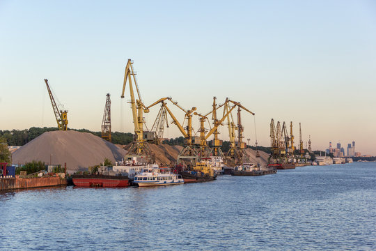 barges and cranes in river port