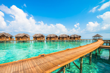 Over water bungalows with steps into amazing green lagoon