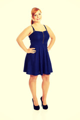 Plus size woman posing in skirt