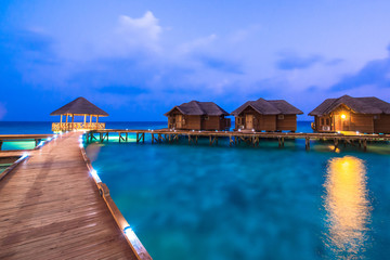 Over water bungalows with steps into amazing green lagoon