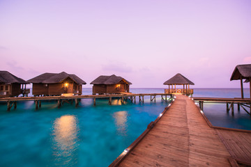 Over water bungalows with steps into amazing green lagoon