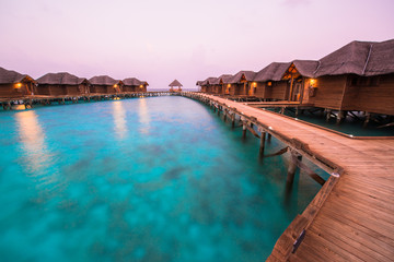 Over water bungalows with steps into amazing green lagoon