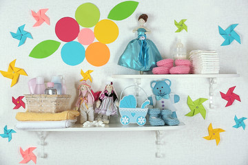 Fototapeta na wymiar Baby accessories on shelves close-up