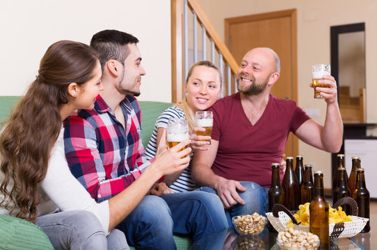 Adults drinking beer indoor