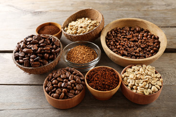 Various of coffee in small dishes on wooden background