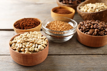 Various of coffee in small dishes on wooden background