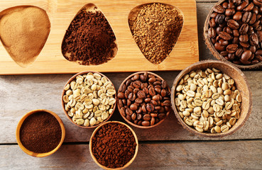 Various of coffee in small dishes on wooden table, top view
