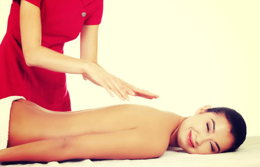 Obraz na płótnie Canvas Young woman massage in spa