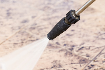Outdoor floor cleaning with high pressure water